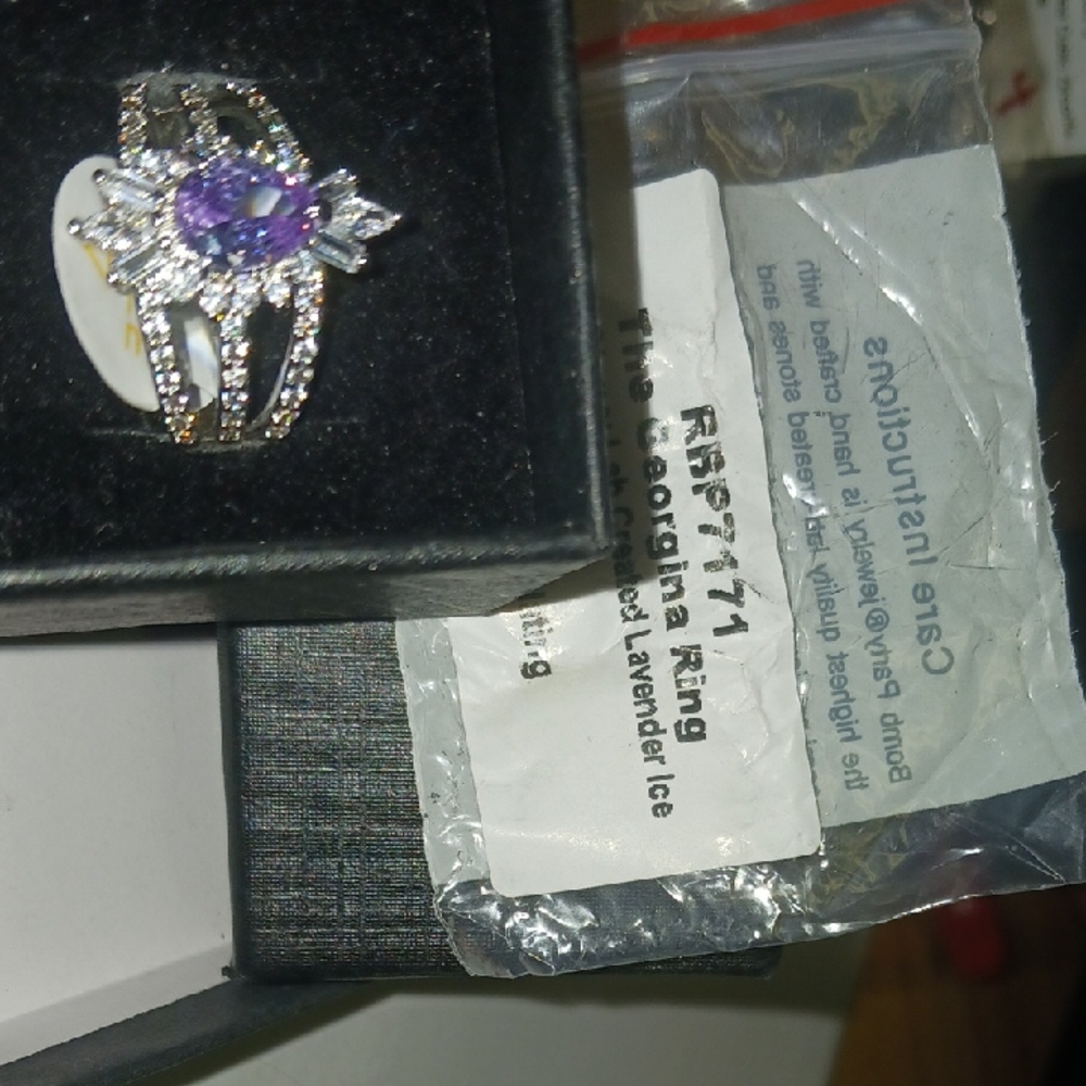 Elegant Lavender Ice Crystal Gemstone Set In A Stunning Rhodium Band.